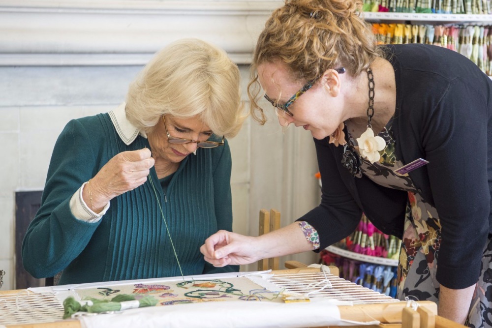 The-Duchess-of-Cornwall-is-taught-hand-embroidery-by-the-Royal-School-of-Ne