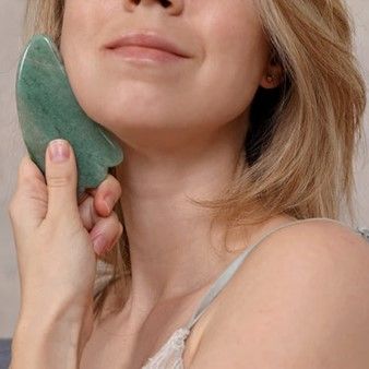 This is a Jade Gua Sha Massage Tool