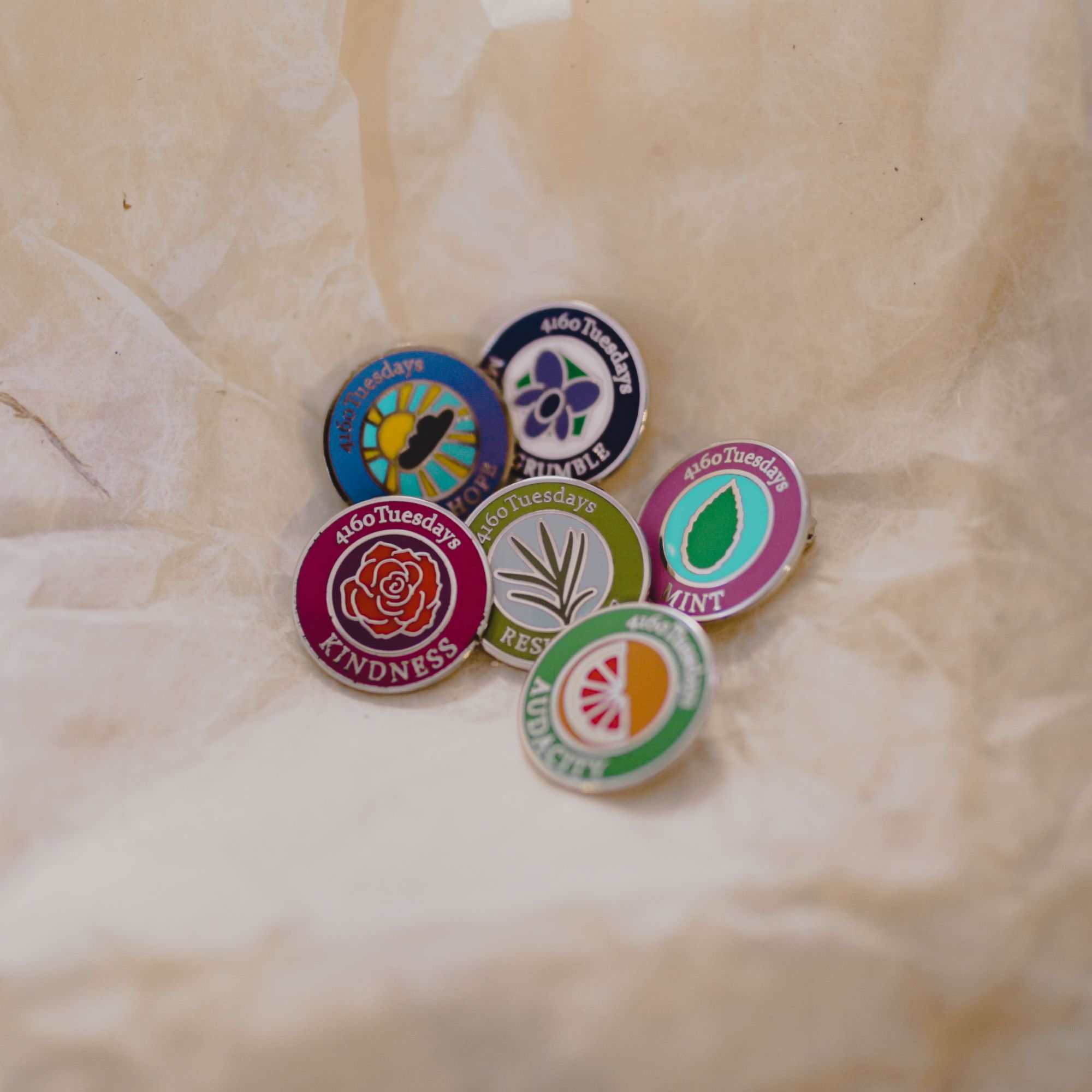 A selection of 6 4160 Tuesdays badges