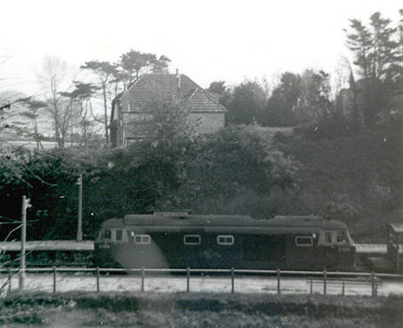 D7090 Goodrington station with freight 1965