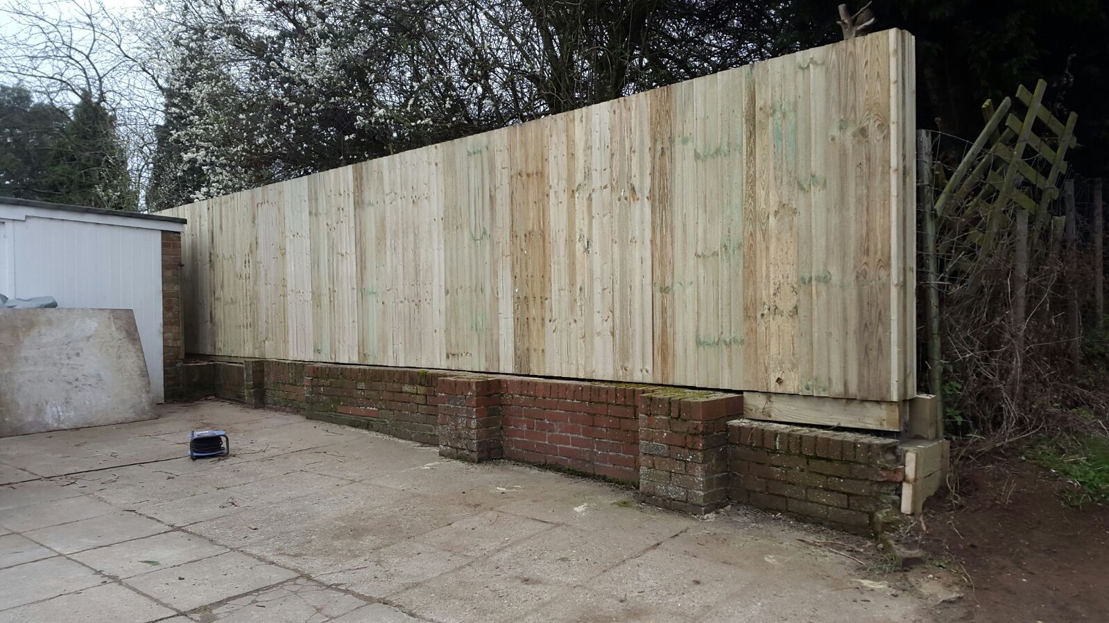 Closeboard fence on top of a wall (3)