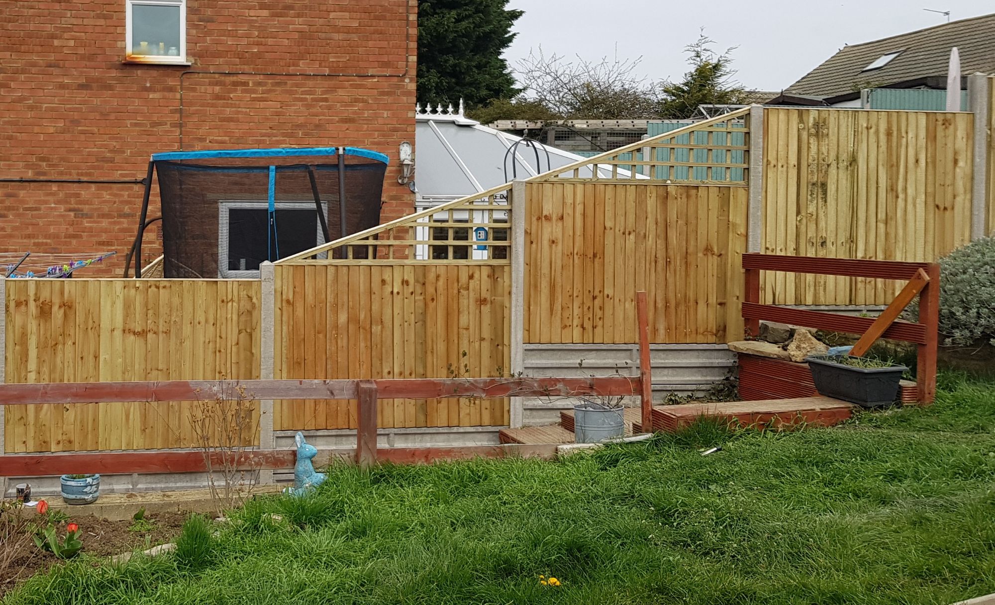 closeboard panels with raking trellis