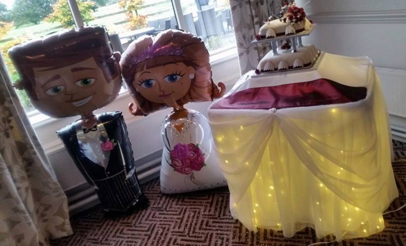 A bride and groom with starlight cake skirt