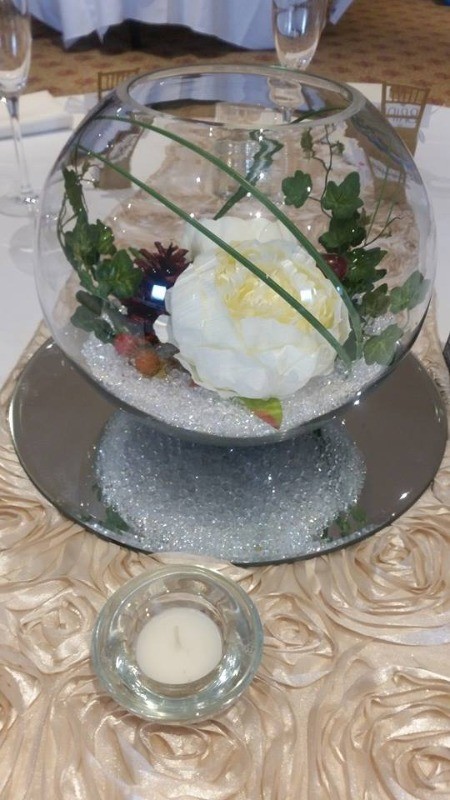 fish bowl with peonies and autumn cones etc