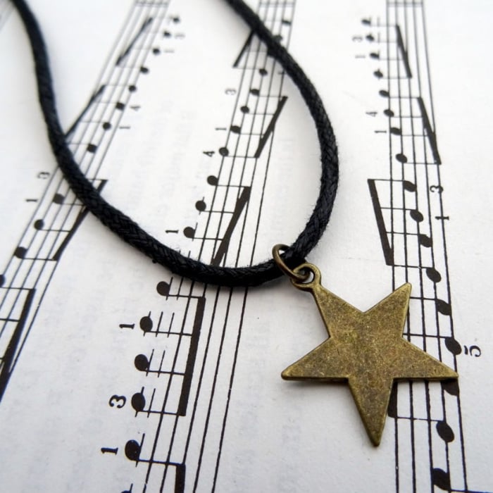 Bronze star charm necklace on black cord MN023