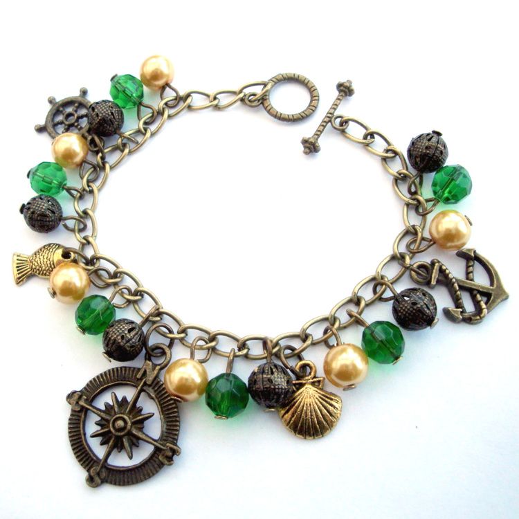 Nautical pirate charm bracelet, green and gold beads and antique bronze cha