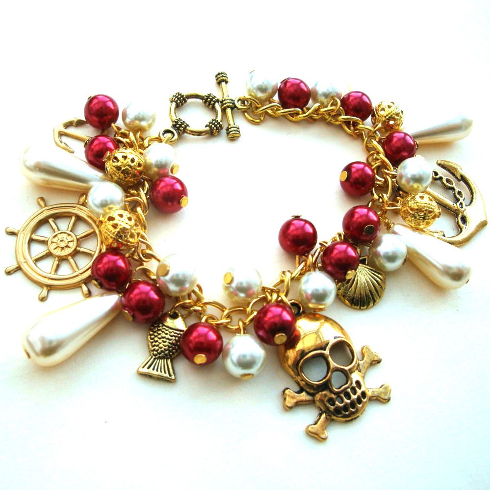 Pirate charm bracelet in gold, red & cream PCB105