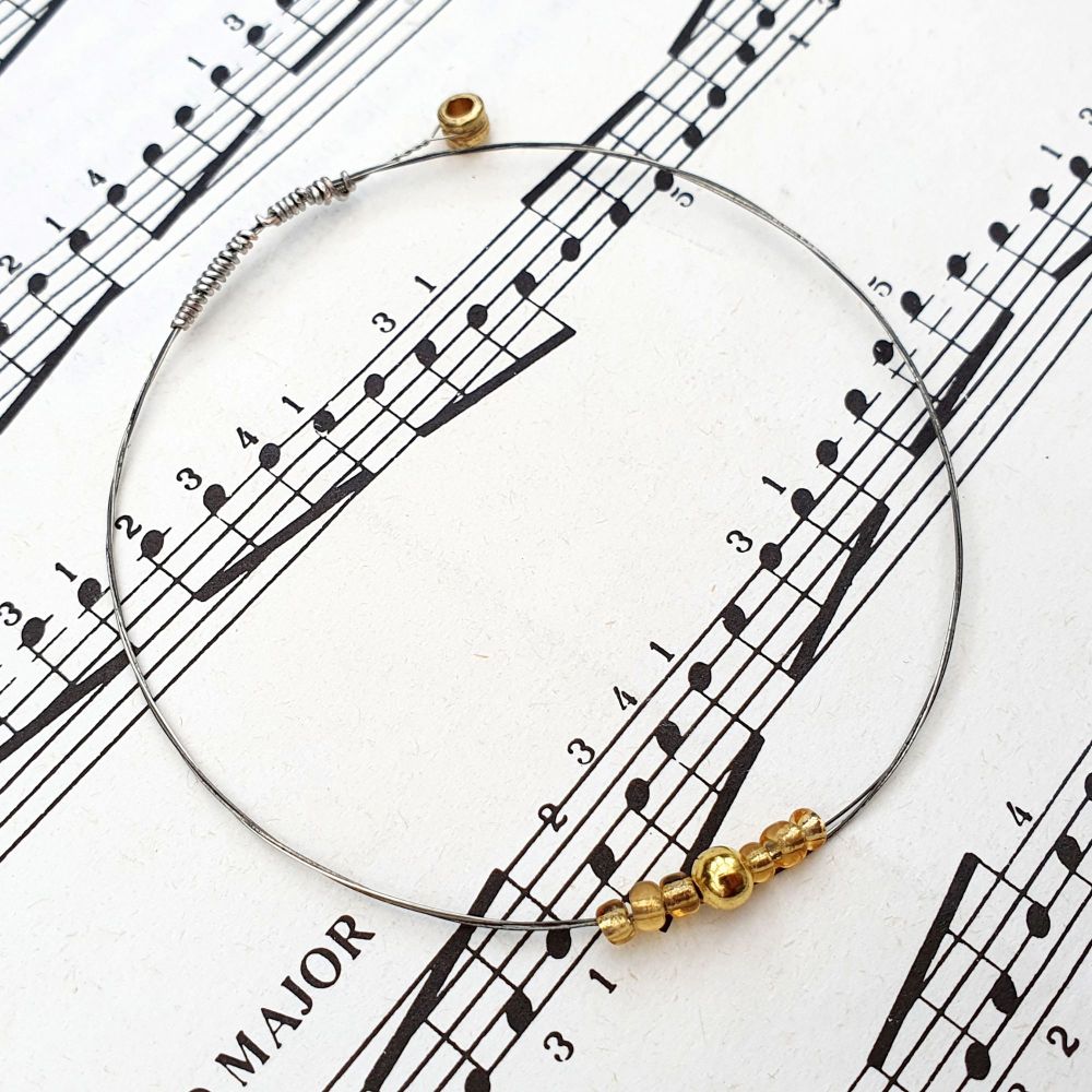 Guitar string bracelet with gold beads & optional music note charm GSB024