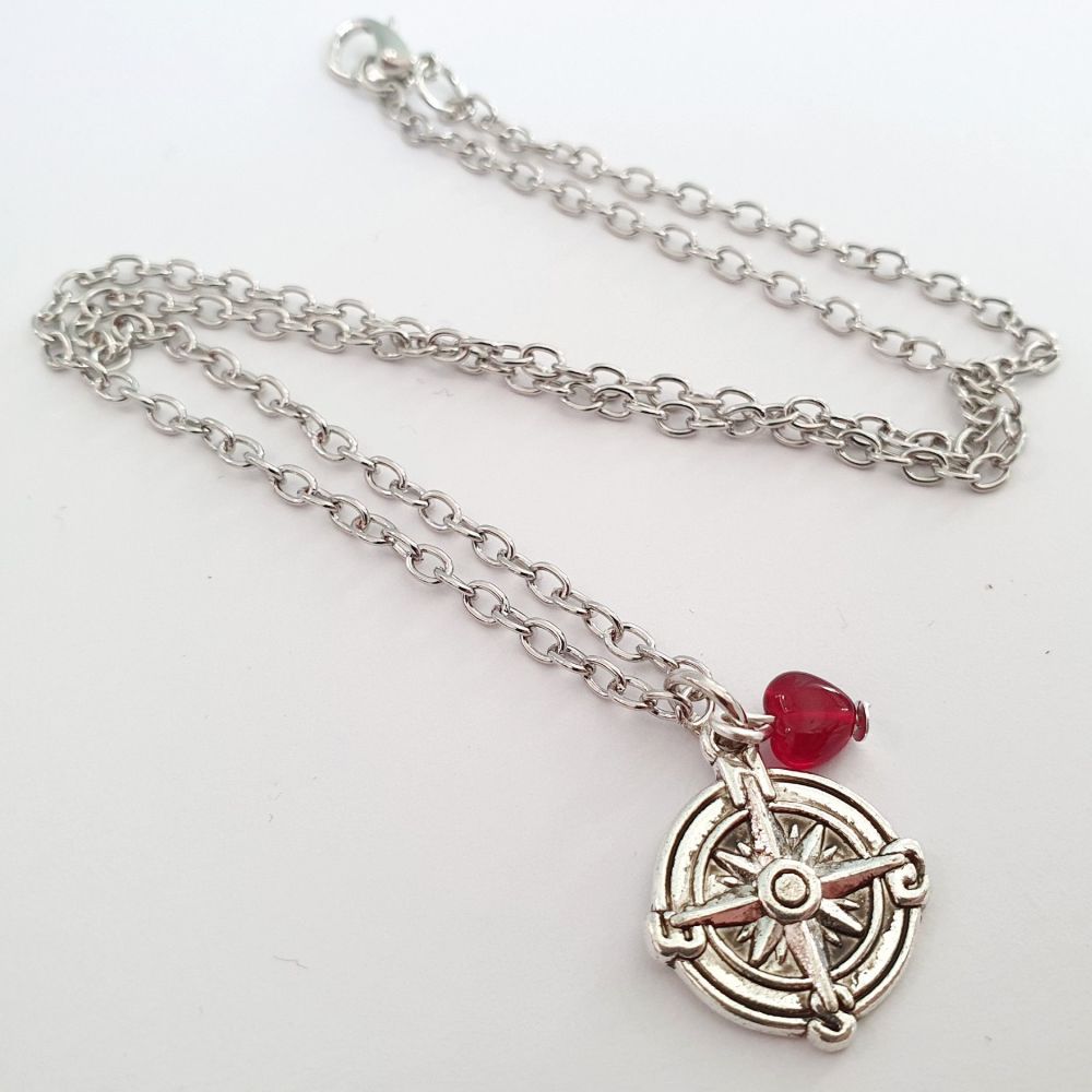 Silver compass and red heart charm necklace