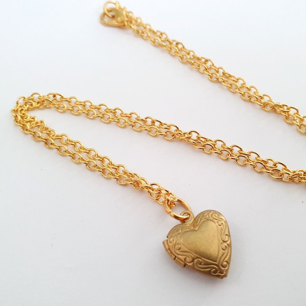 Tiny brass heart shaped locket necklace