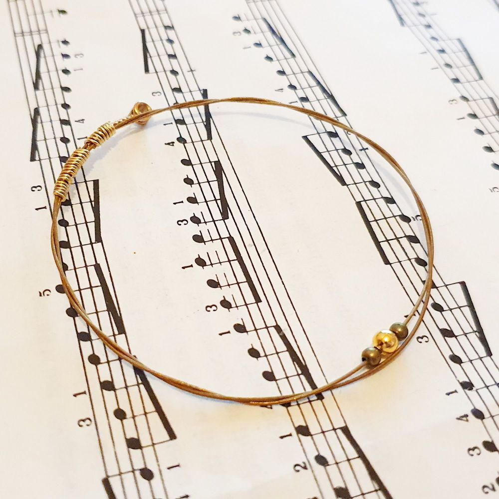 Acoustic guitar string bracelet with gold & bronze beads GSB026