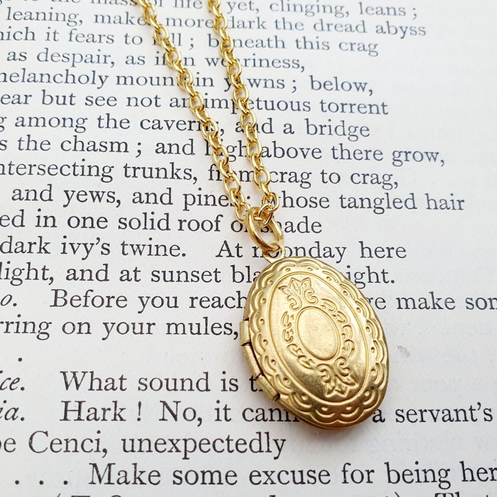 Small oval brass locket necklace on gold plated chain