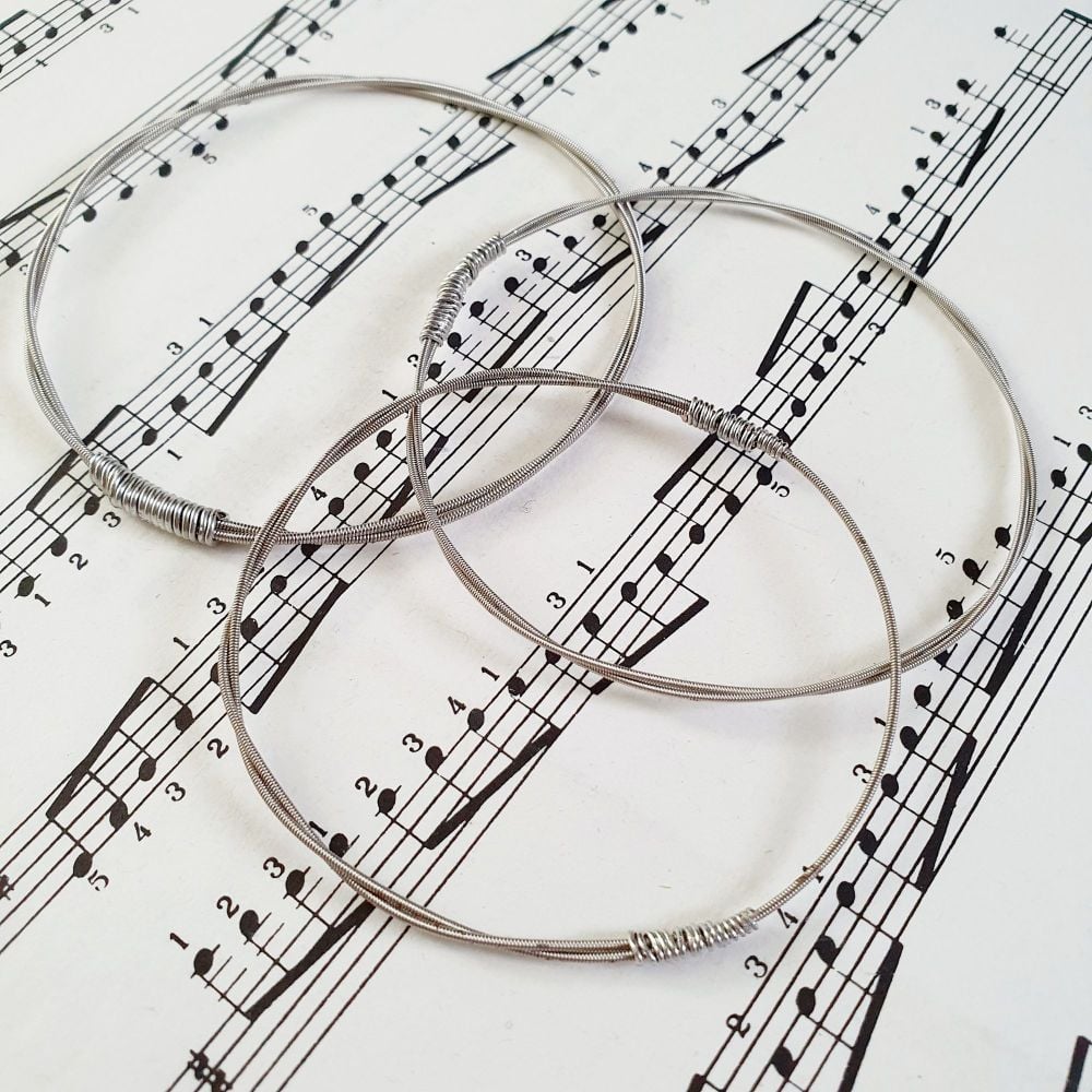 Guitar string bracelet made from a wound string