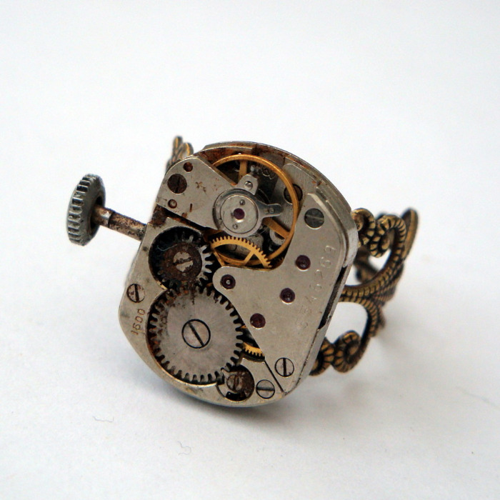 Steampunk ring with watch movement on bronze filigree base SR055
