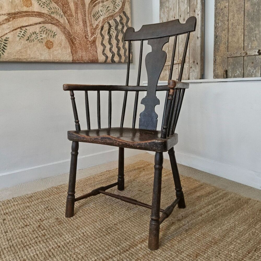 Primitive comb back armchair