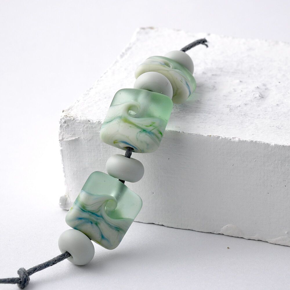 Soft Green Lampwork Glass Pressed Beads