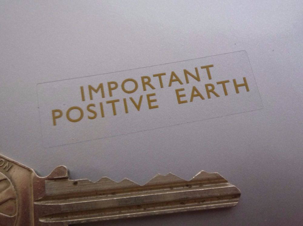 Positive Earth Gold on Clear Sticker. 1.75".