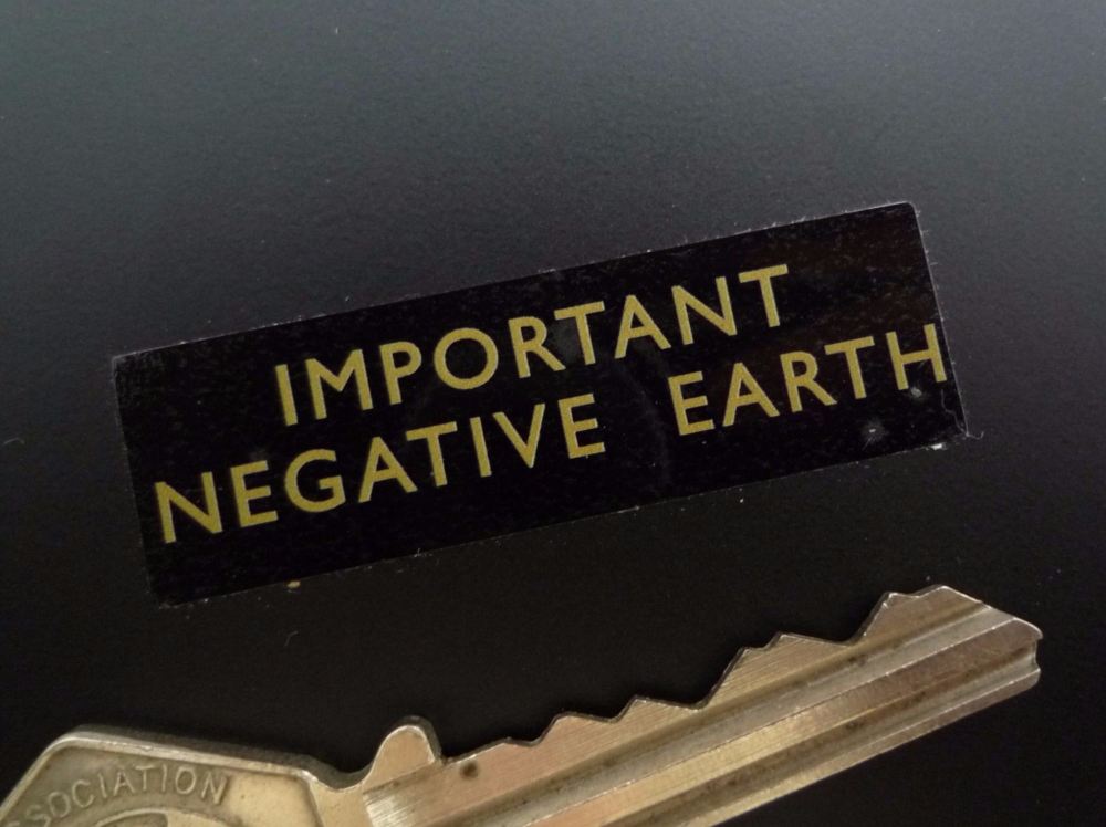 Negative Earth Thin Text Gold on Clear Sticker. 1.75
