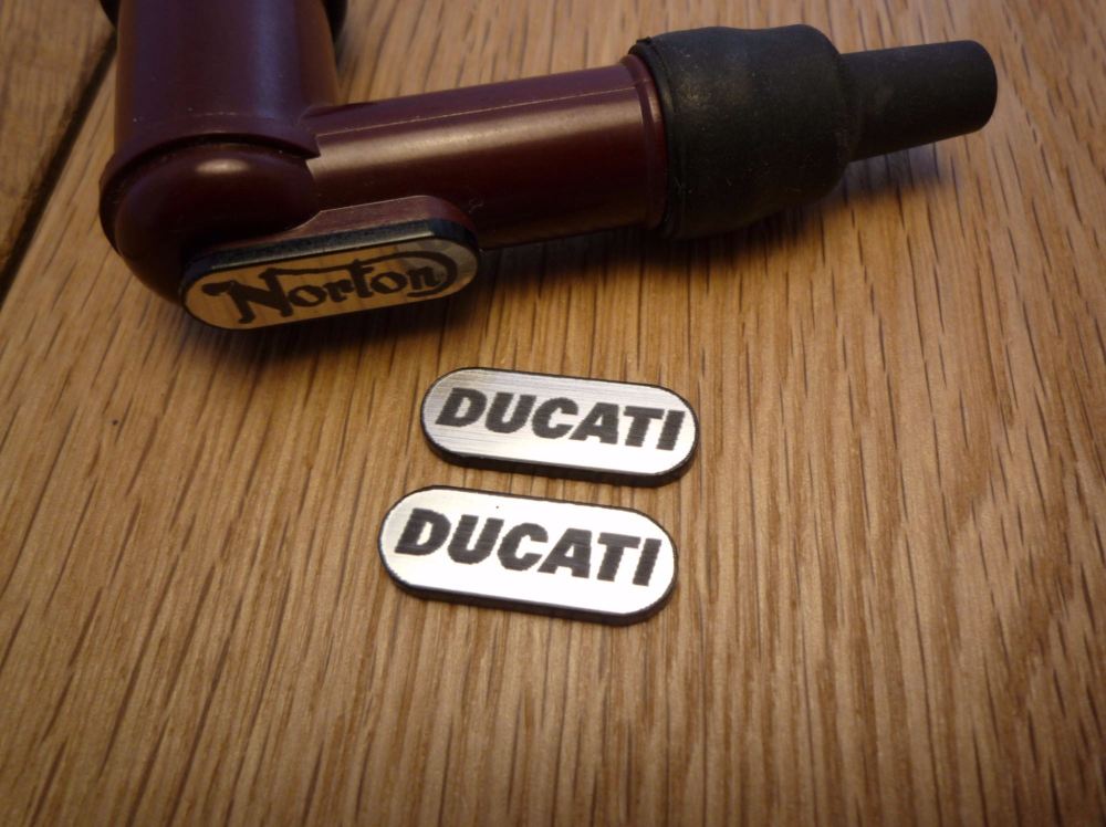 Ducati NGK Spark Plug HT Cap Cover Badges. 22mm Pair.