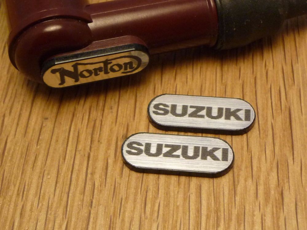Suzuki NGK Spark Plug HT Cap Cover Badges. 22mm Pair.