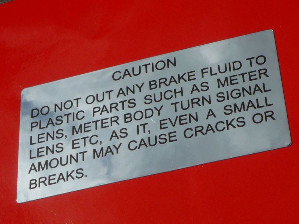 Suzuki GT750, 550, 380, 250, 185 etc. 'Caution Brake Fluid on Plastic Parts' Chrome Foil Sticker. 66mm.