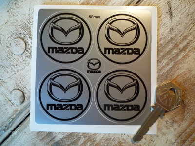 Mazda Logo Black & Silver Wheel Centre Stickers. Set of 4. 50mm