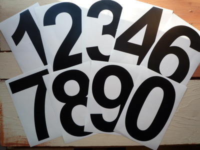 A Racing Number Sticker. Arial Font. Various Sizes.