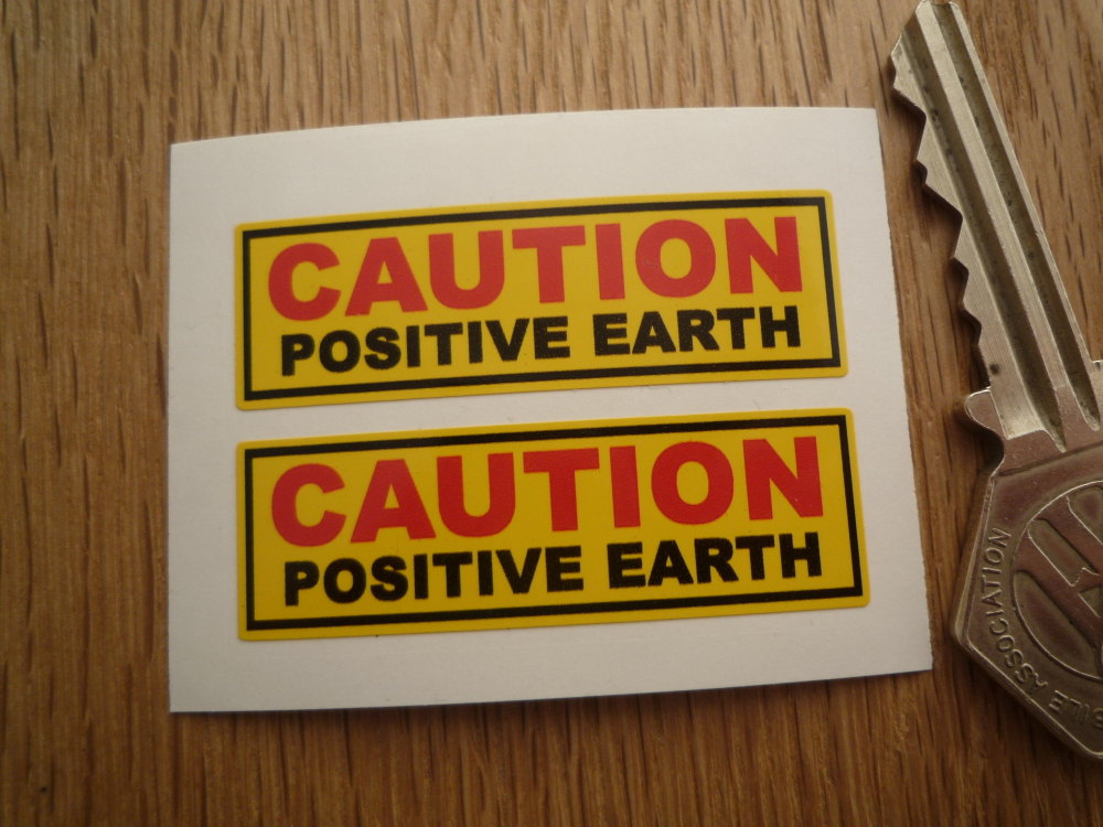 Caution Positive Earth Yellow Stickers. 2" Pair.