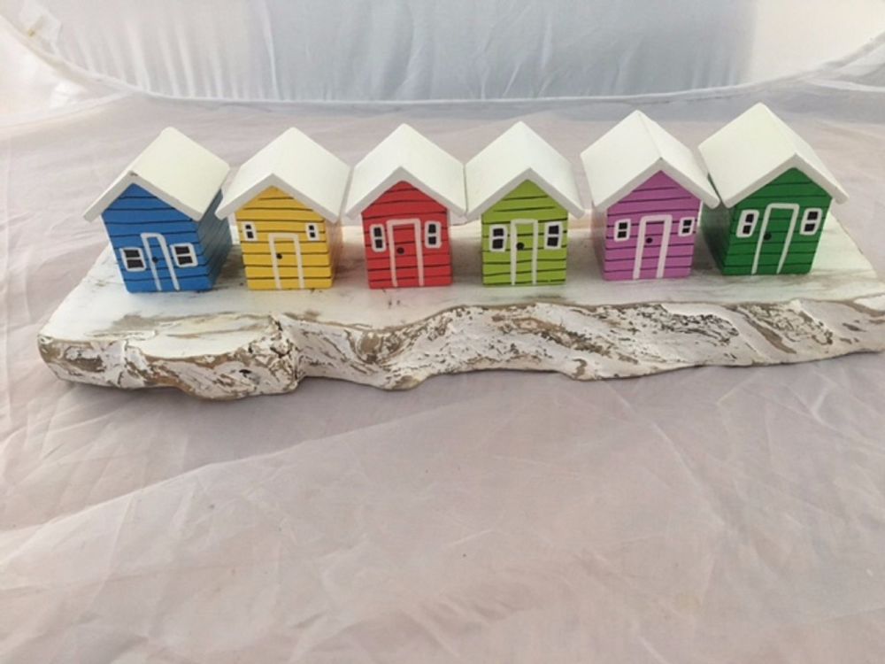Row of 6 Wooden Colourful Beach Huts on White Cliffs
