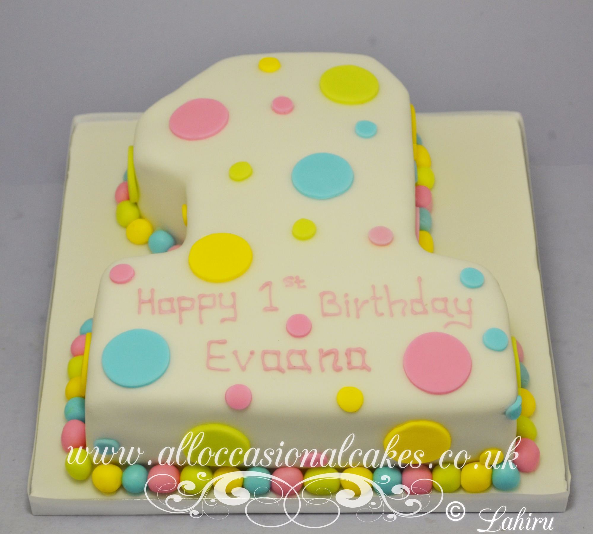multi coloured dot 1st birthday cake