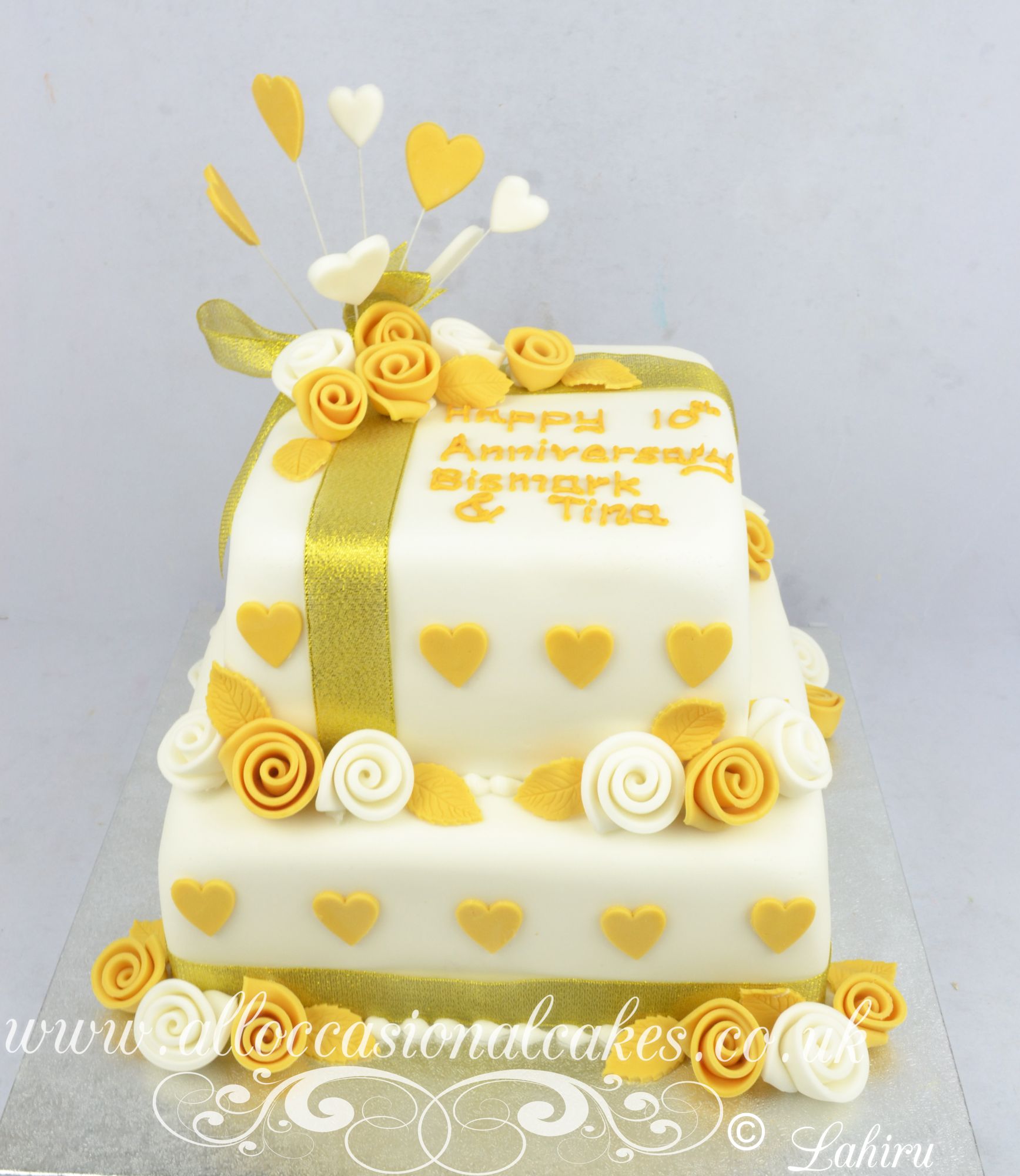 gold and ivory anniversary cake