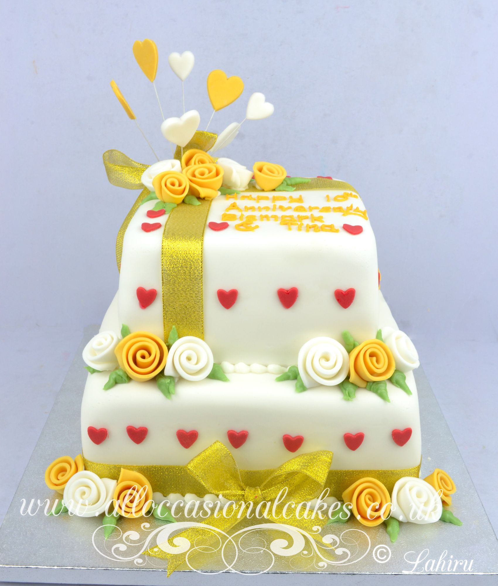 gold rose and red heart anniversary cake