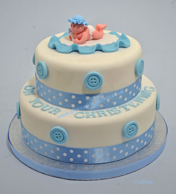 Baby boy with blue buttons christening cake