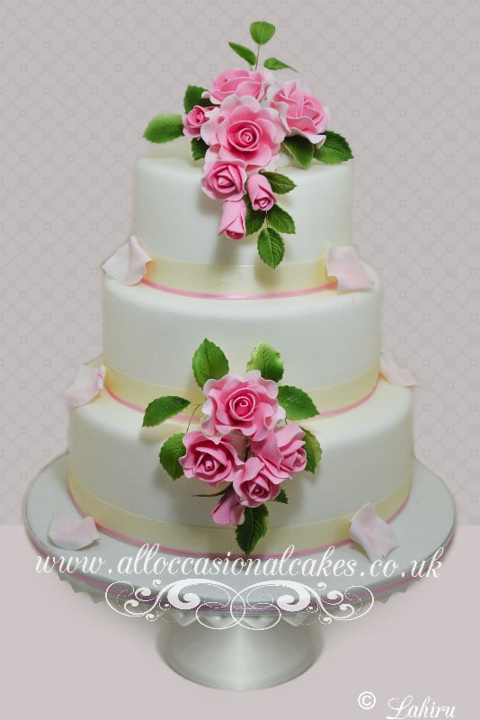 Sugar Rose with Cascading Petal on Each Tier Wedding Cake, bristol wedding cakes, cakes pictures, magic wedding cakes,  uk cakes, uk wedding cakes, emersons green wedding cakes, cheap cakes, best cakes, international wedding cakes, international cakes, egg free cakes, egg less cakes, downend cakes, king cakes, downend wedding cakes, colourful cakes, all occasional cakes, cakes for all occasions, tasty wedding cakes, golden wedding cakes, sweet wedding cakes, anniversary cakes, sri lankan wedding,  wedding cakes, england wedding cakes, england cakes, birthday cakes, google cakes, winter cakes, snow cakes, topsy turvy cakes, cascade, cheap cakes, cheap wedding cakes, special wedding cakes, best cakes, uk, cakes, cake, cake makers, weddings, wedding, bristol, bristoluk, bath, bathuk, novelty cake, novelty cakes, unique cake, unique cakes, custom cake, custom cakes, birthday cake, birthday cakes, wedding cake, wedding cakes, corporate cake, corporate cakes, winning wedding cakes, winning cakes, yate wedding cakes, filton wedding cakes, clifton wedding cakes, winterbourne wedding cakes, London wedding cakes, royal wedding cakes, bristol wedding cakes, wedding cakes Bristol, wedding cake Bristol, Asian wedding cakes, indian wedding cakes, expensive cakes, expensive wedding cakes, rich wedding cakes, royal wedding cakes, rich cakes, gold wedding cakes, 24k wedding cakes, tasty wedding cakes, royal wedding cakes, queen wedding cakes, queen birthday cake, king's wedding cakes, Kings birthday cakes, prince wedding cakes, prince birthday cakes, best cakes, love cake, magic cakes, cake, fairy cakes, hot cakes, cupcakes, cupcake cakes, fondant cakes, cupcakes, my ace cakes of uk, cakes Sri Lanka, fab cakes, cakes sri lanka, south Gloucestershire, cake decoration, catering for weddings, Lahiru Peiris,