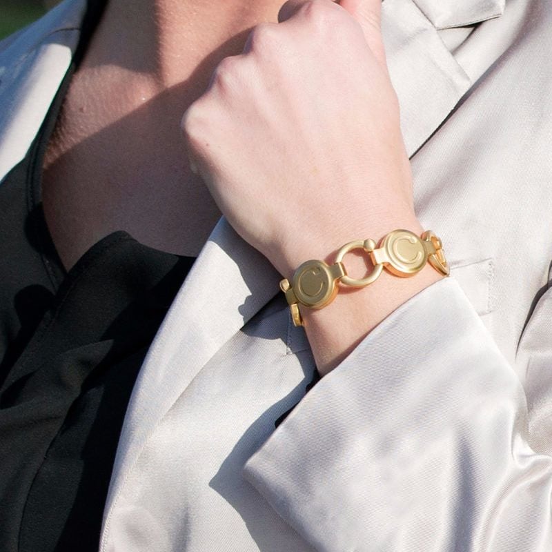 Pirouette brushed gold being worn.jpg