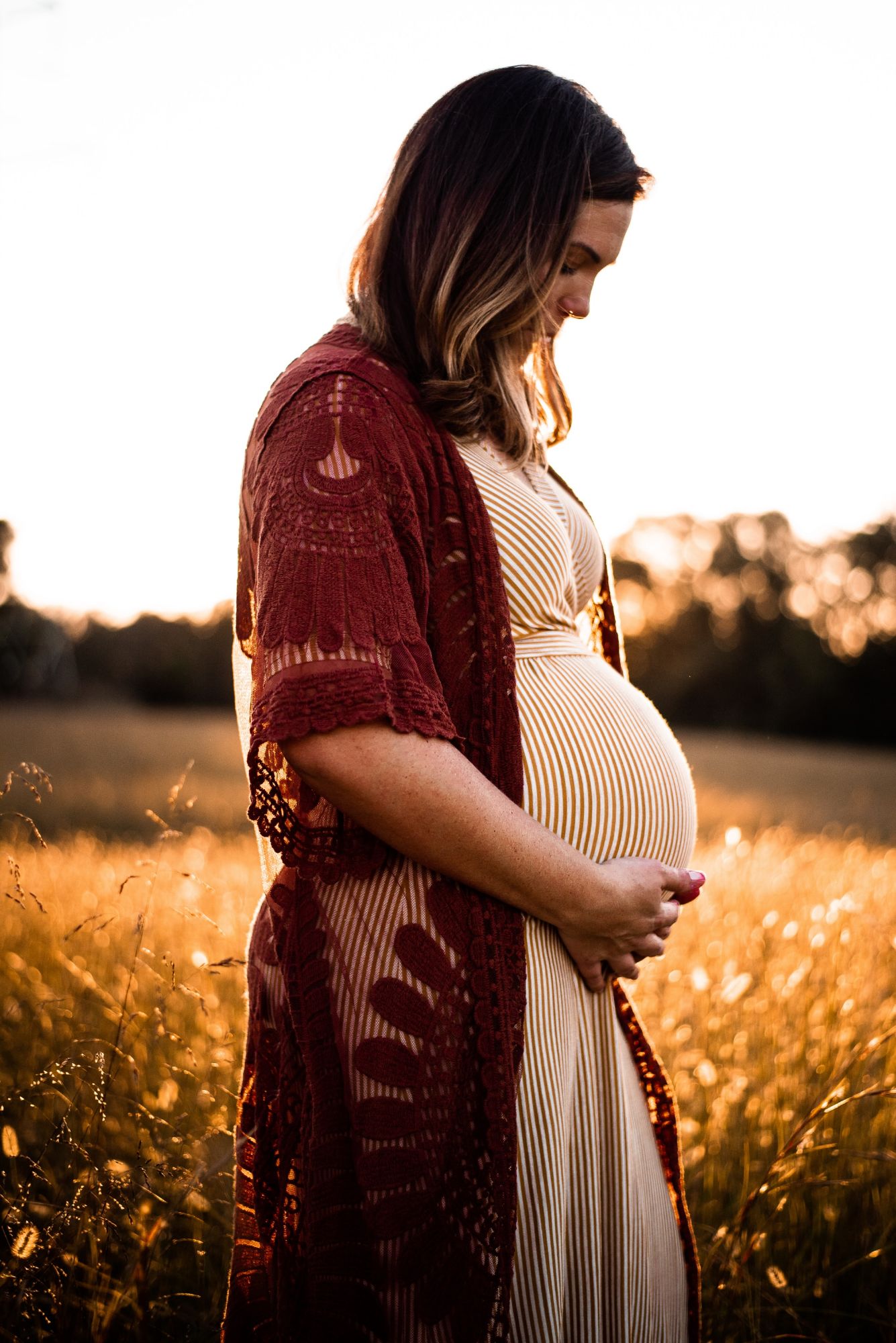 Pregnant Women craddling her bump