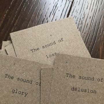 Text prompts used in soundwalk. Brown card with examples of sounds such as sound of loss, sound of delusion printed on. 
