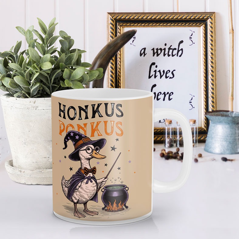 Personalised Honkus Ponkus Halloween Goose Mug | beige mug with black and orange vintage-style illustrations with black cat on pumpkin and wizard goose