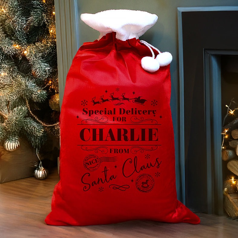 Personalised Red Special Delivery Christmas Sack | plush velvety fabric with fluffy white pompoms, personalised with your name