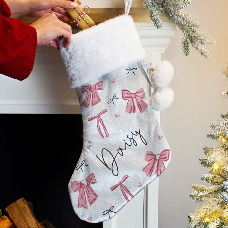 Personalised Pink Bow Christmas Stocking | plush velvety pale grey coquette Santa stocking with fluffy white pompoms, personalised with your name