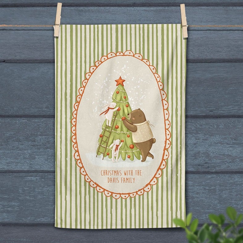 Personalised cotton Christmas Tree tea towel with festive green stripes and whimsical hand-drawn illustration