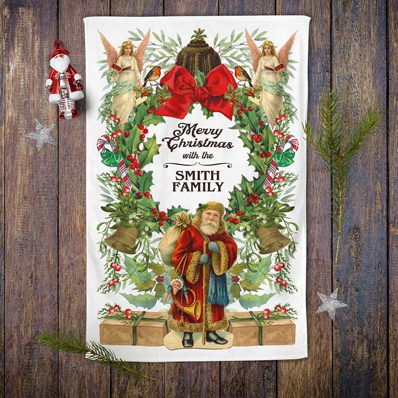 Personalised cotton Victorian Christmas tea towel featuring colourful festive vintage illustrations