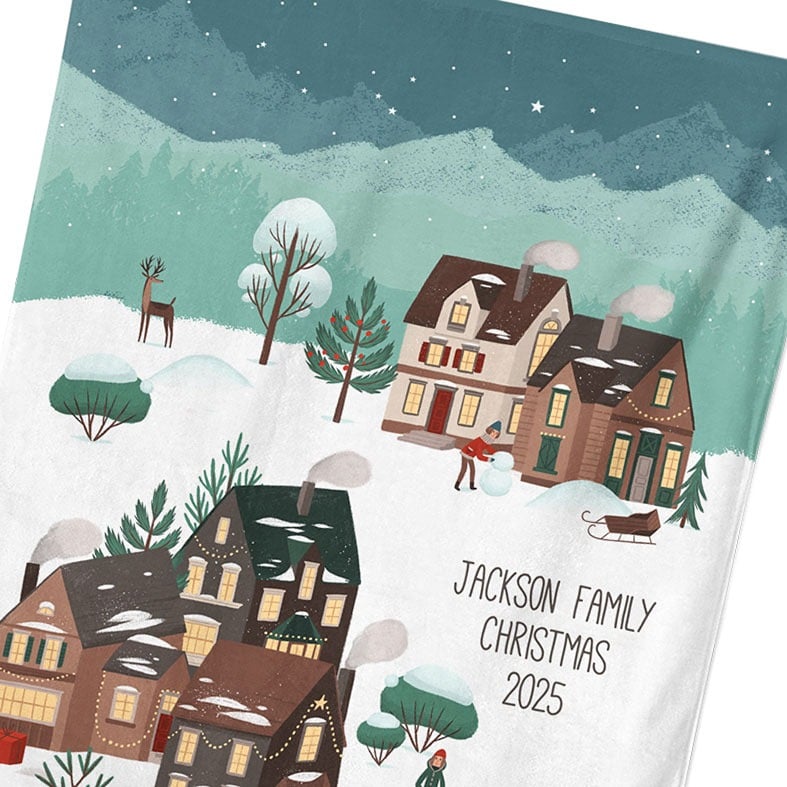 Personalised cotton Christmas tea towel with colourful festive village snow scene hand-drawn illustrations