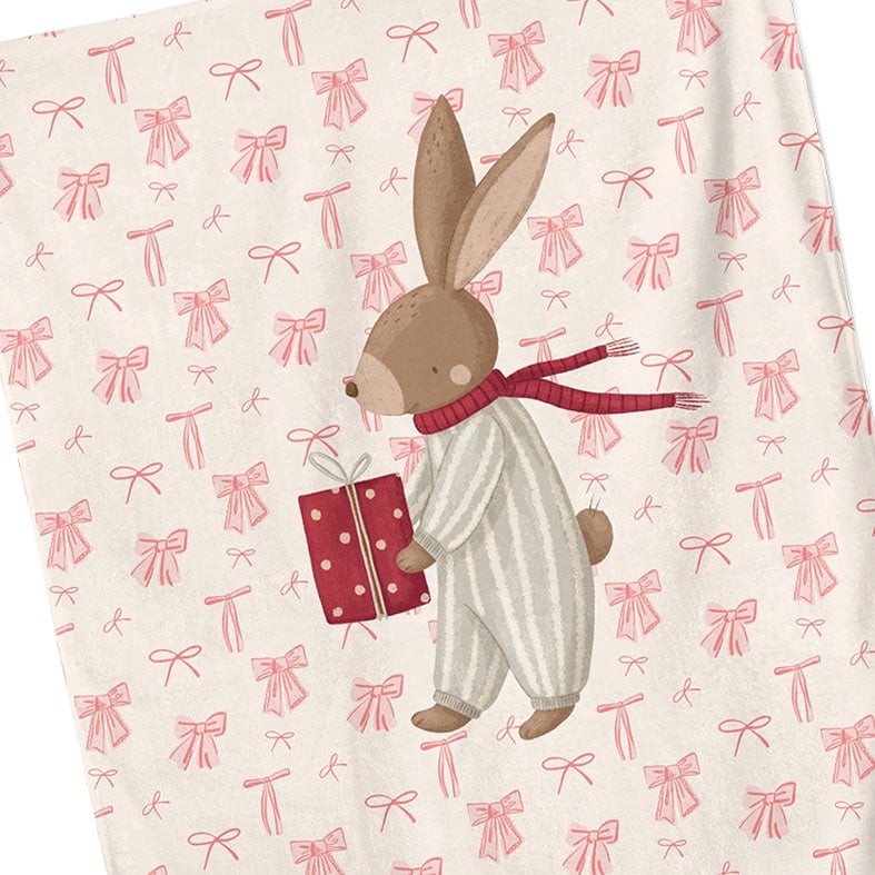 Personalised cotton Christmas tea towel with hand-drawn festive bunny illustration on a background of pink bows