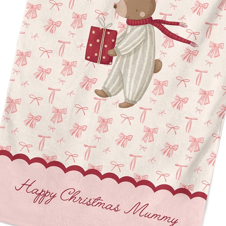 Personalised cotton Christmas tea towel with hand-drawn festive bunny illustration on a background of pink bows