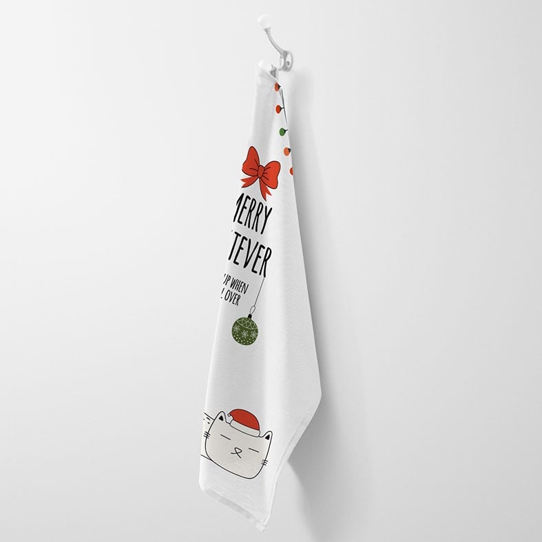 Personalised Christmas tea towel in white or beige with funny sleepy cat illustration and Merry Whatever wording