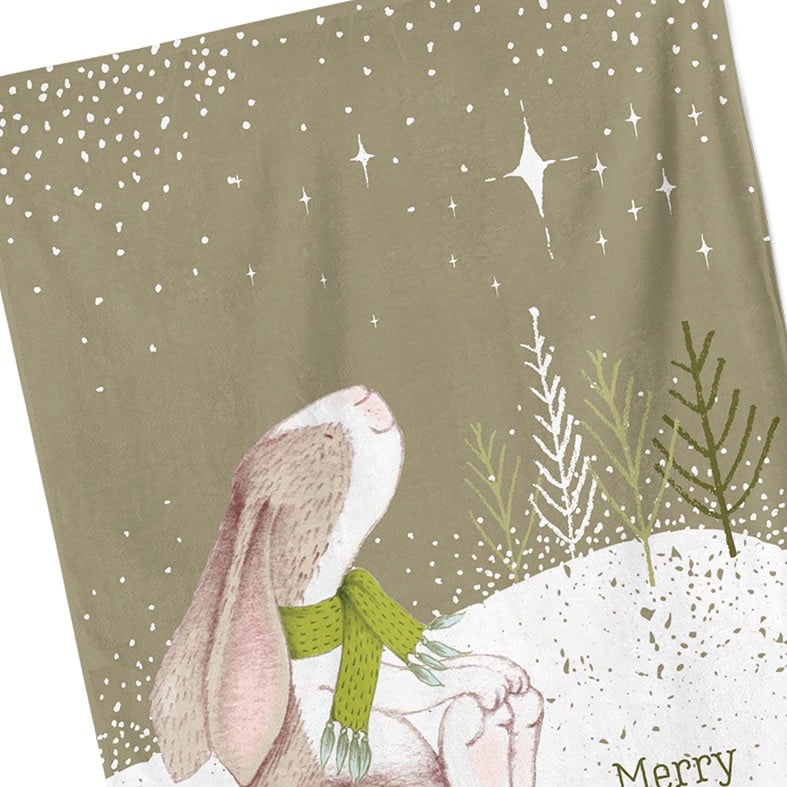 Personalised cotton Christmas tea towel in sage green with snowy scene and sweet winter rabbit illustration