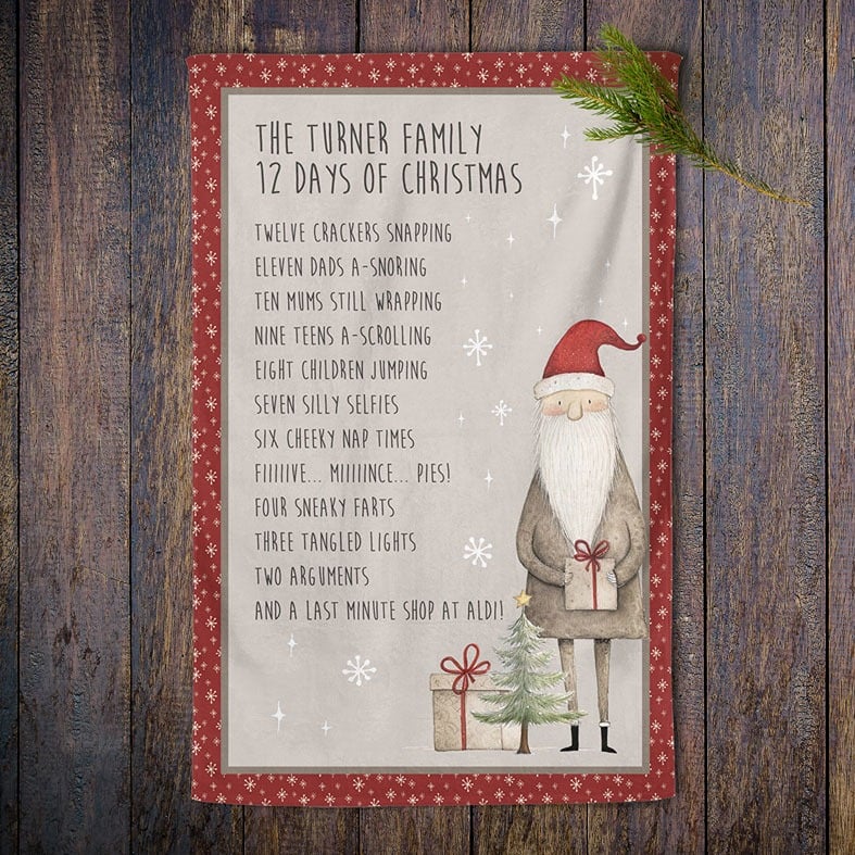 Personalised cotton Christmas tea towel in red and beige with a Santa illustration and funny rewording of 12 Days of Christmas