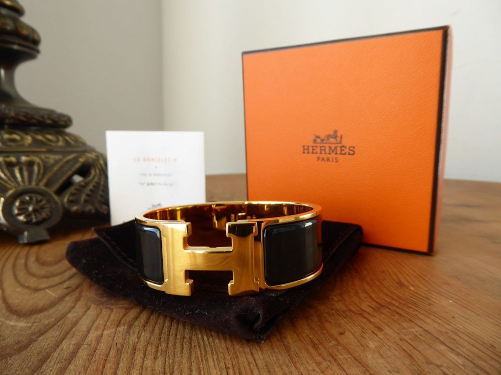 Hermés Clic Clac H Wide Cuff Bracelet PM in Gold with Black Enamel - SOLD
