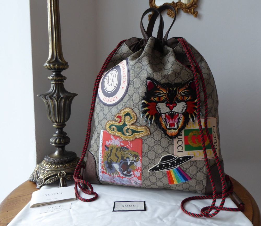 Gucci Courrier Soft GG Supreme Drawstring Backpack in Ebony Beige Monogram 